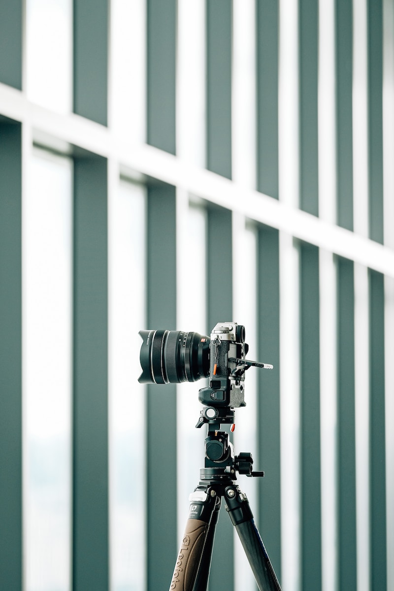 a camera on a tripod in front of a building